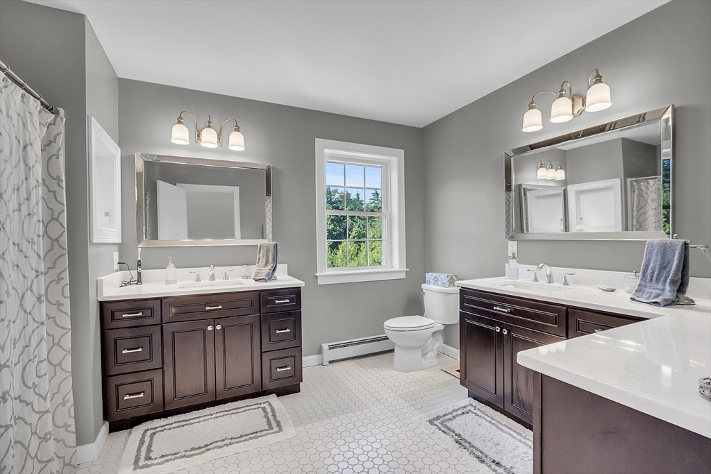 65 Easter Brook Road Lunenburg, MA 01462 - Photo 26 of 39 a kitchen with a stove a sink and a window