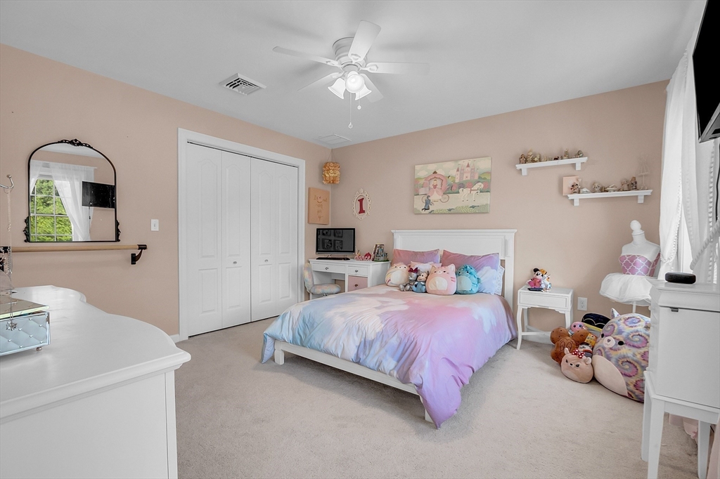 65 Easter Brook Road Lunenburg, MA 01462 - Photo 27 of 39 a bedroom with a bed and a chandelier