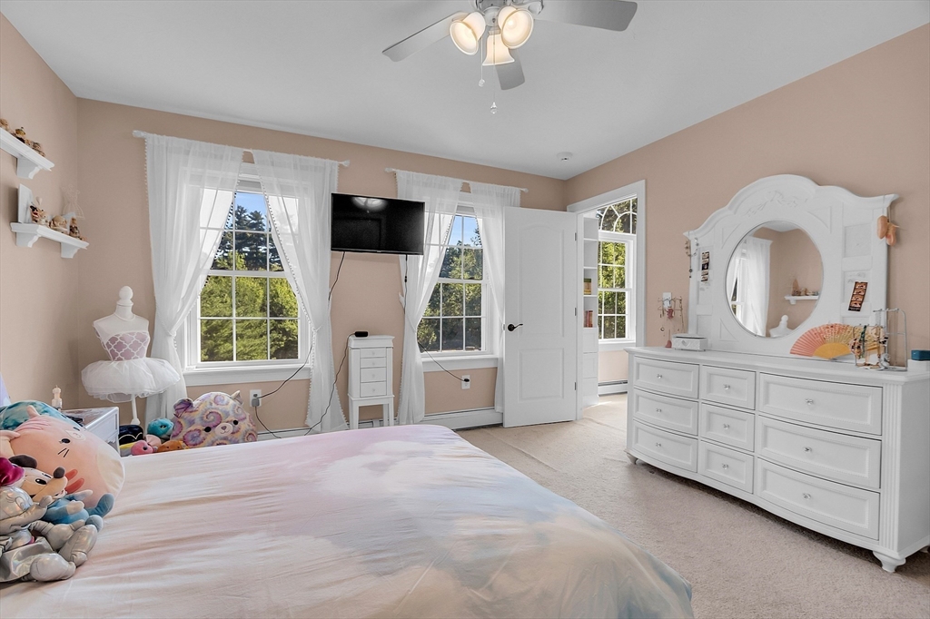 65 Easter Brook Road Lunenburg, MA 01462 - Photo 28 of 39 a bedroom with a bed and a chandelier