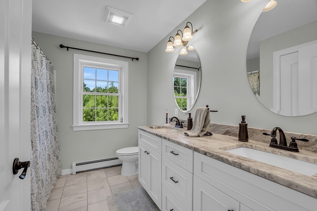 65 Easter Brook Road Lunenburg, MA 01462 - Photo 29 of 39 a bathroom with double sink and a mirror