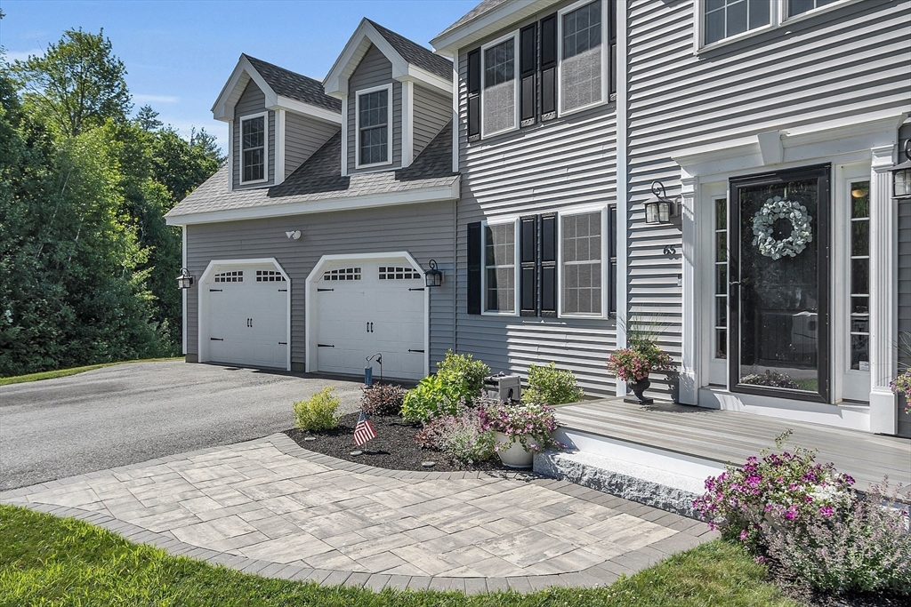 65 Easter Brook Road Lunenburg, MA 01462 - Photo 3 of 39 a front view of a house with a yard