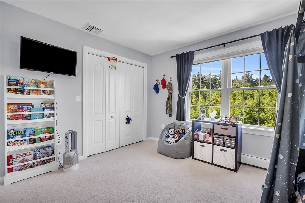 65 Easter Brook Road Lunenburg, MA 01462 - Photo 31 of 39 a bedroom with furniture and a flat screen tv