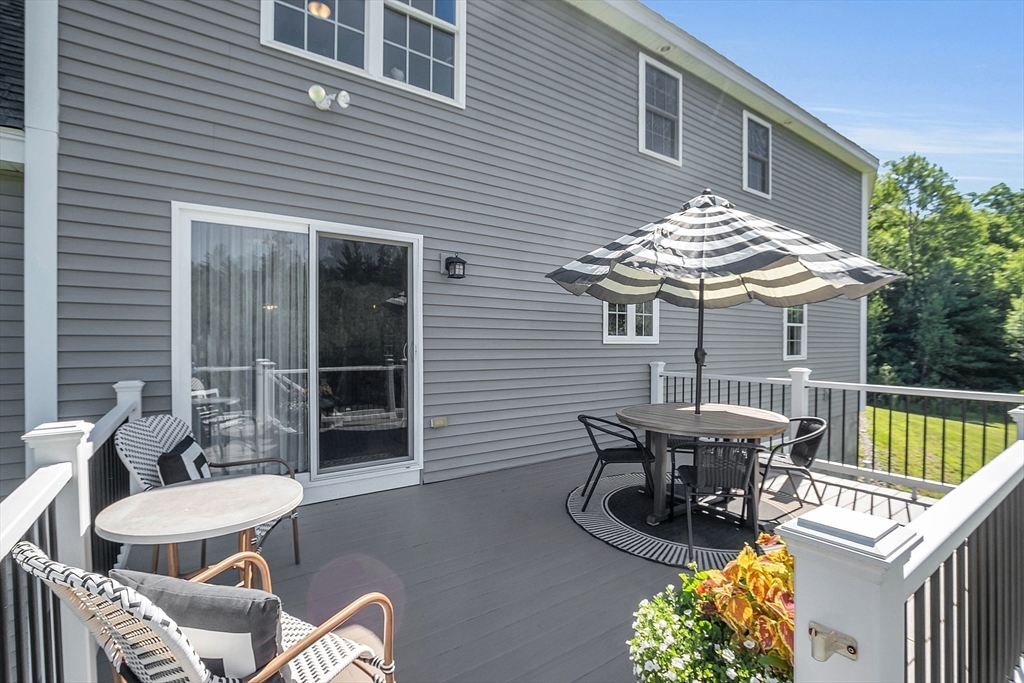 65 Easter Brook Road Lunenburg, MA 01462 - Photo 33 of 39 a view of a patio with a table and chairs