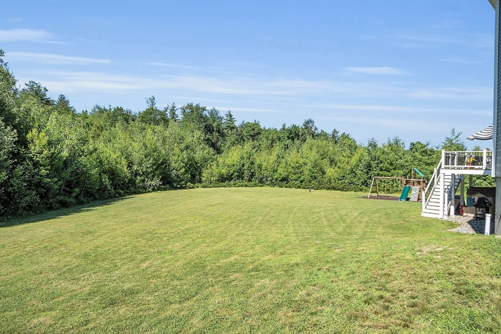 65 Easter Brook Road Lunenburg, MA 01462 - Photo 35 of 39 a view of a big yard with an outdoor space