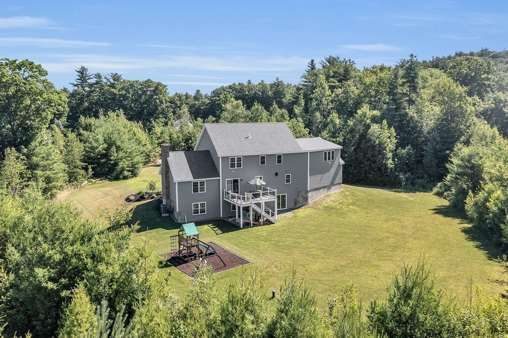 65 Easter Brook Road Lunenburg, MA 01462 - Photo 37 of 39 a view of a house with pool and a yard
