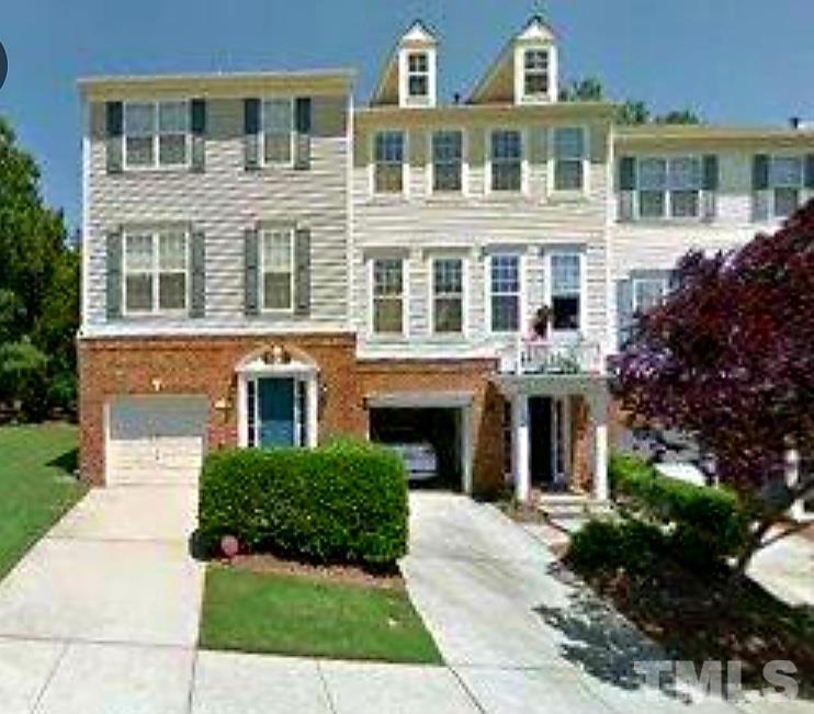 7236 Galon Glen Road Raleigh, NC 27613 - Photo 1 of 24 a front view of a building with garden
