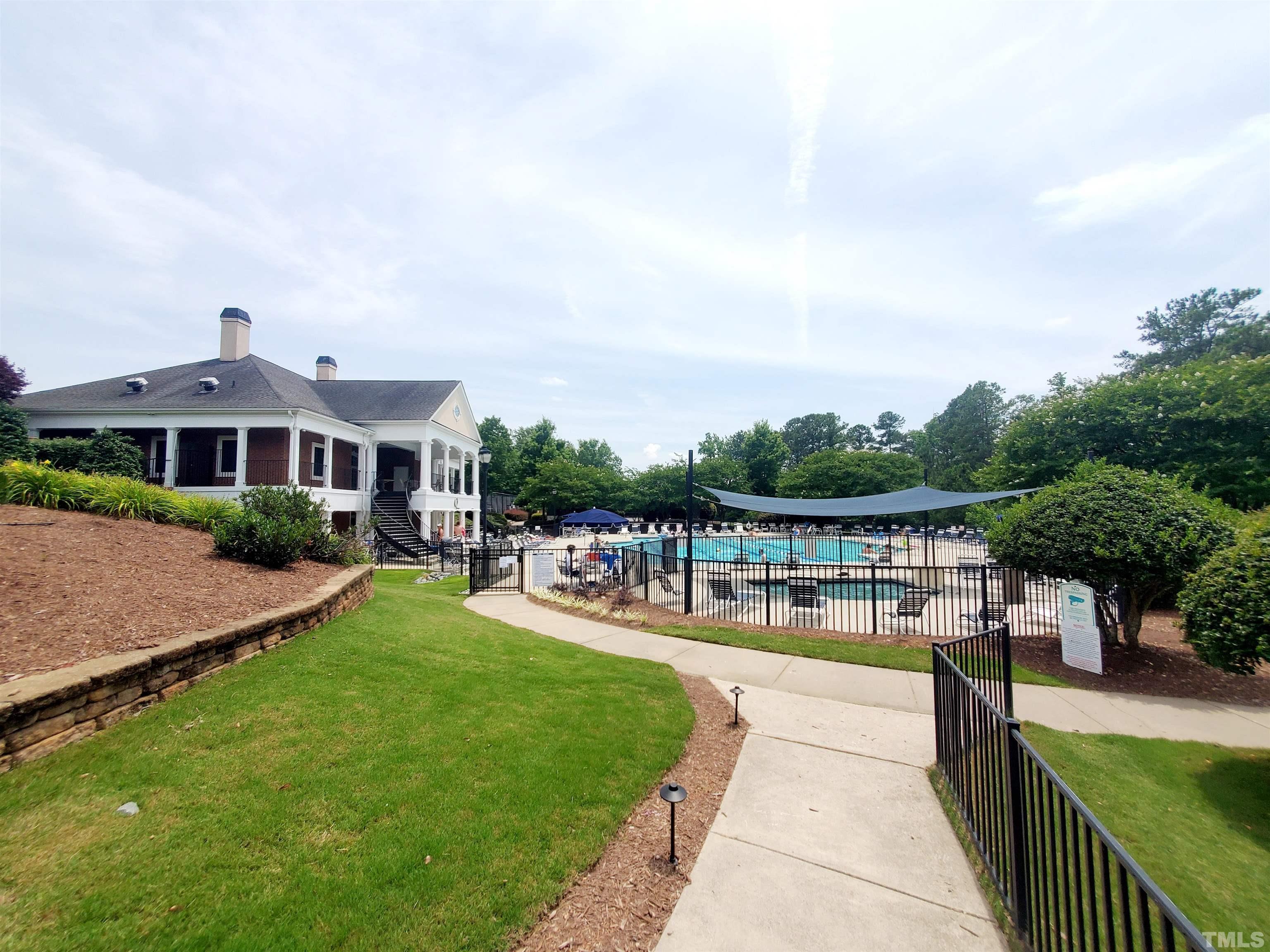 7236 Galon Glen Road Raleigh, NC 27613 - Photo 2 of 24 a view of a house with pool and chairs