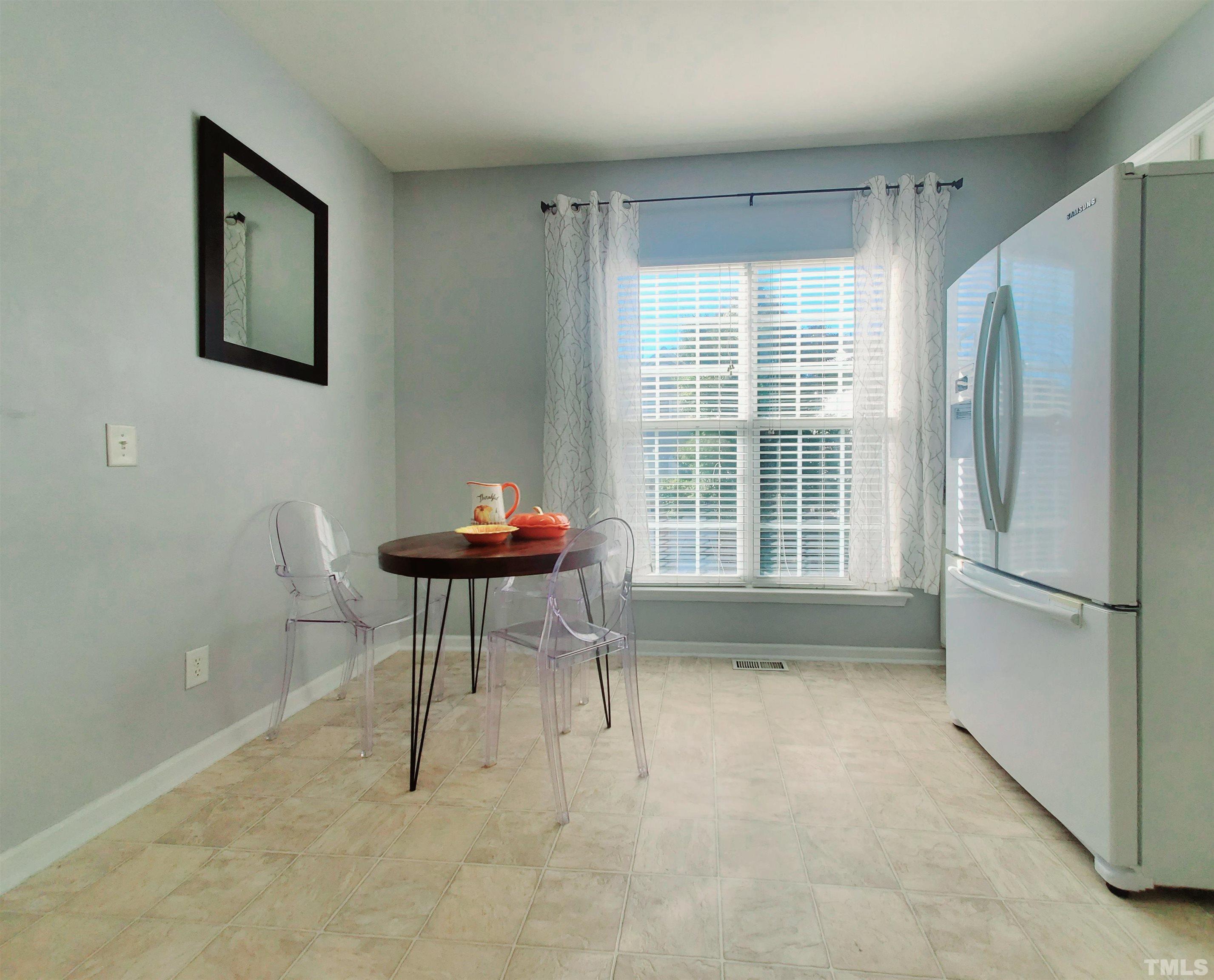 7236 Galon Glen Road Raleigh, NC 27613 - Photo 13 of 24 a living room with a furniture and a large window