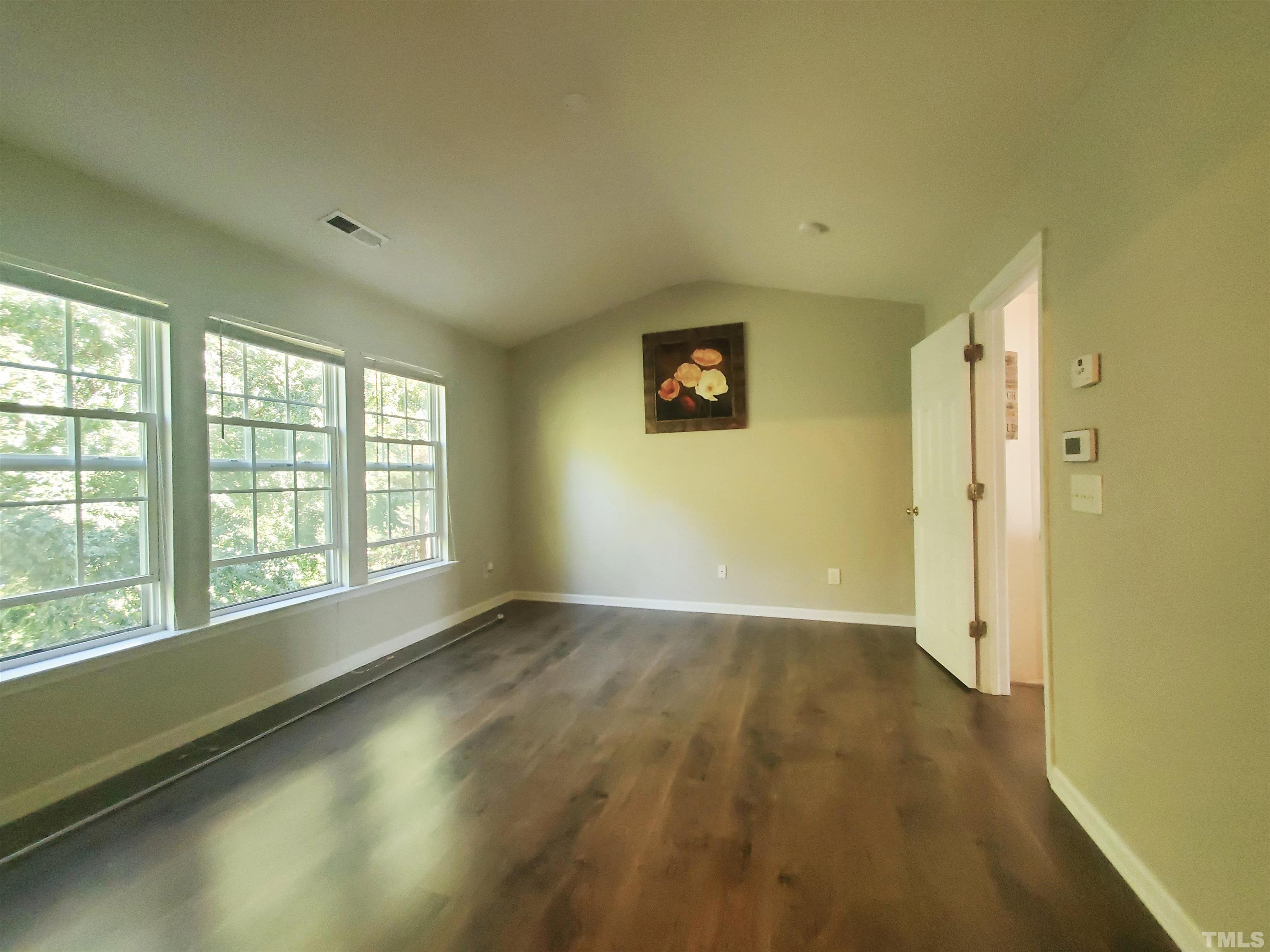 7236 Galon Glen Road Raleigh, NC 27613 - Photo 16 of 24 a view of an empty room with a window