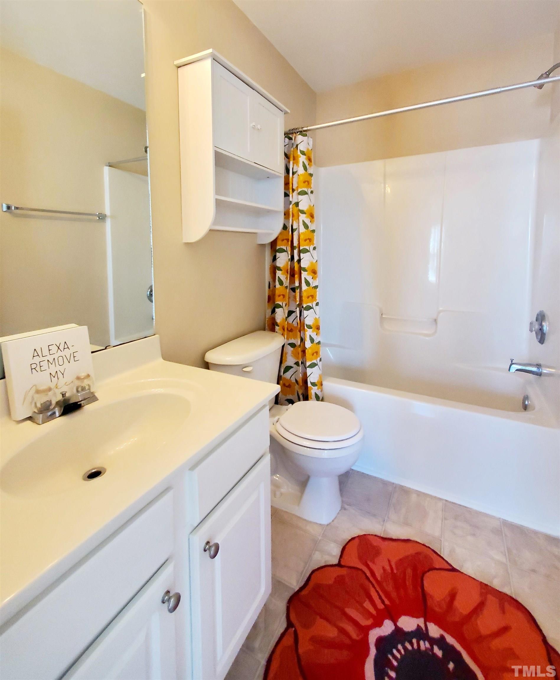 7236 Galon Glen Road Raleigh, NC 27613 - Photo 20 of 24 a bathroom with a sink toilet and shower