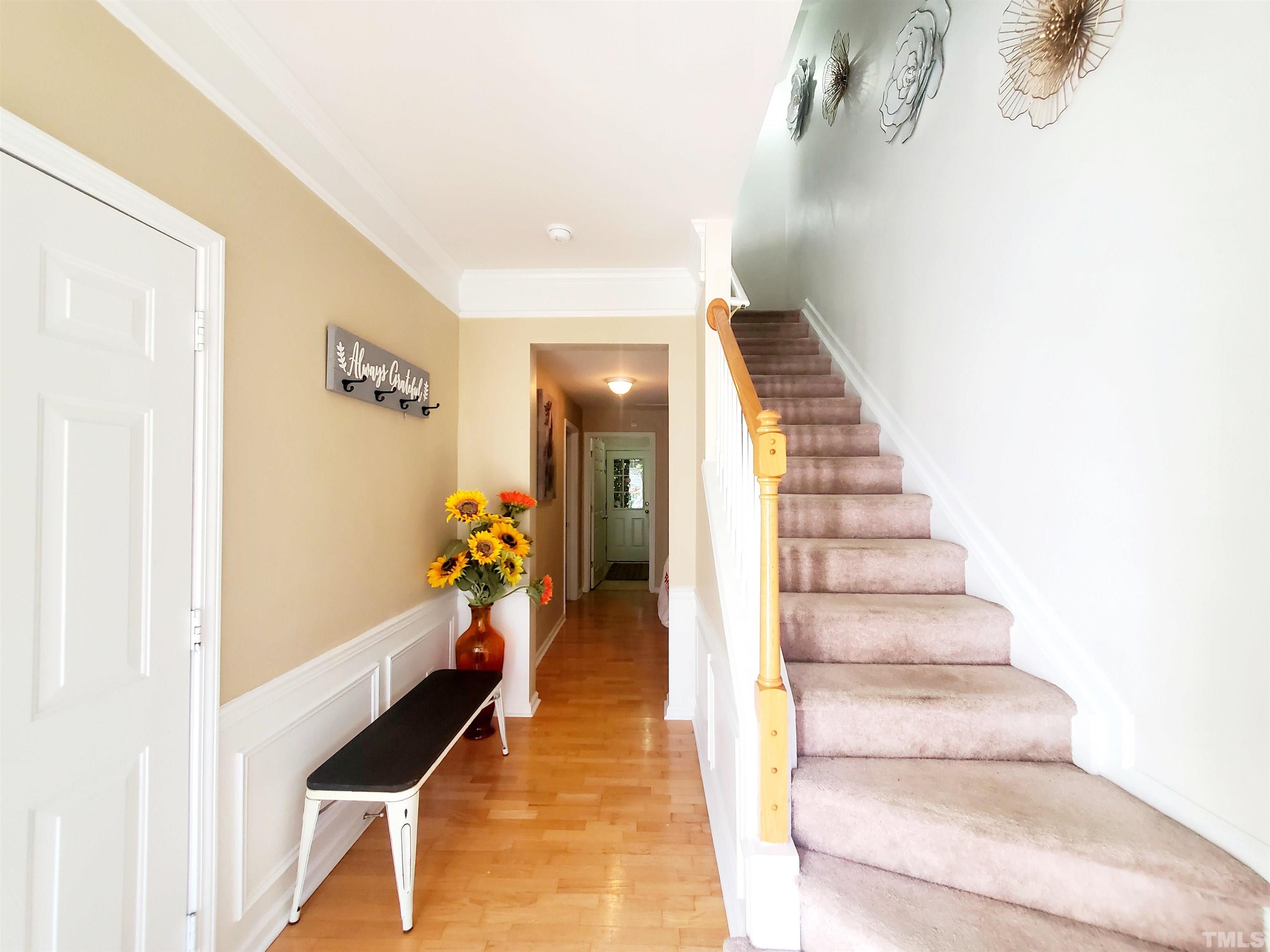 7236 Galon Glen Road Raleigh, NC 27613 - Photo 4 of 24 a view of entryway and hall with wooden floor