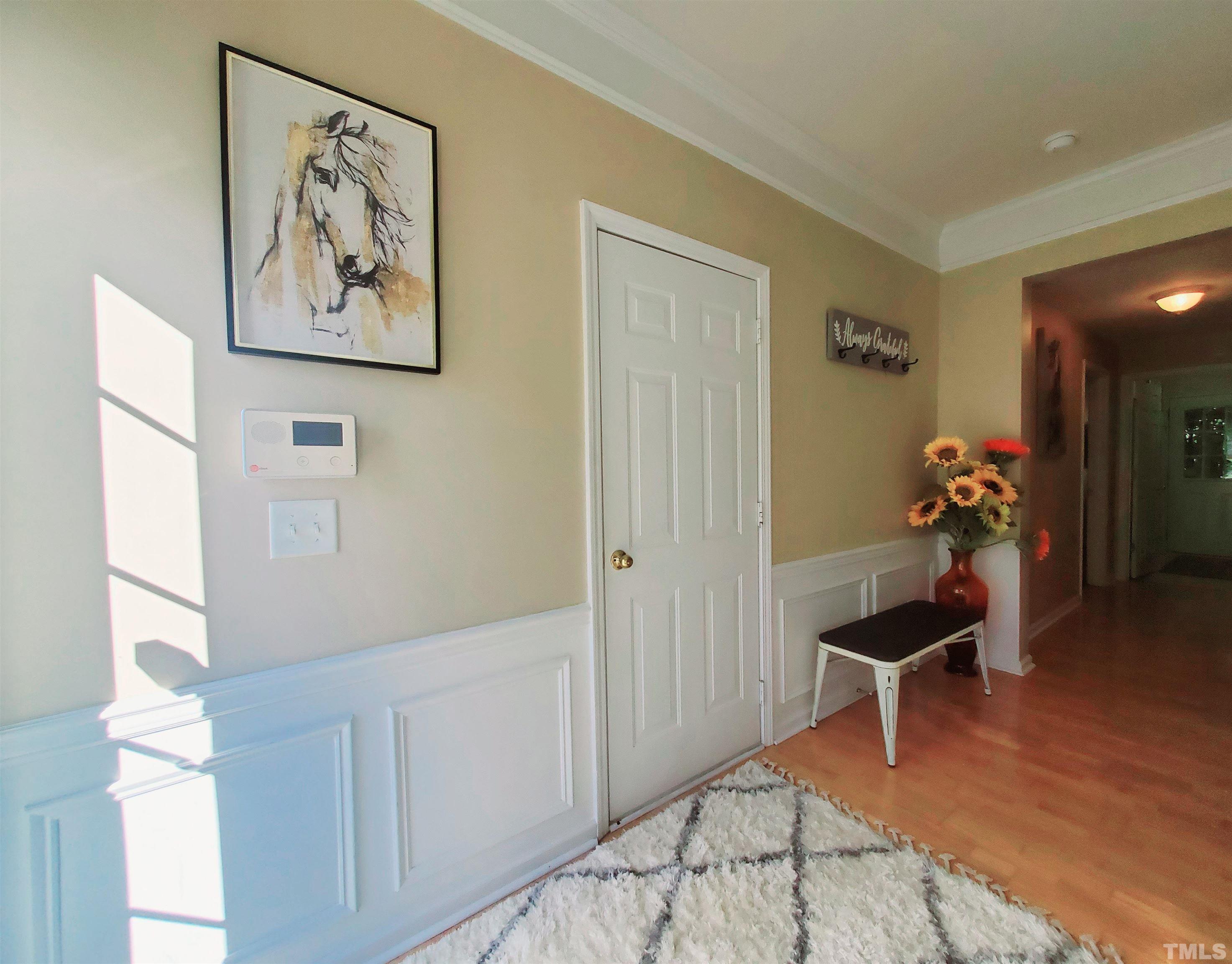 7236 Galon Glen Road Raleigh, NC 27613 - Photo 5 of 24 a living room with furniture and wooden floor