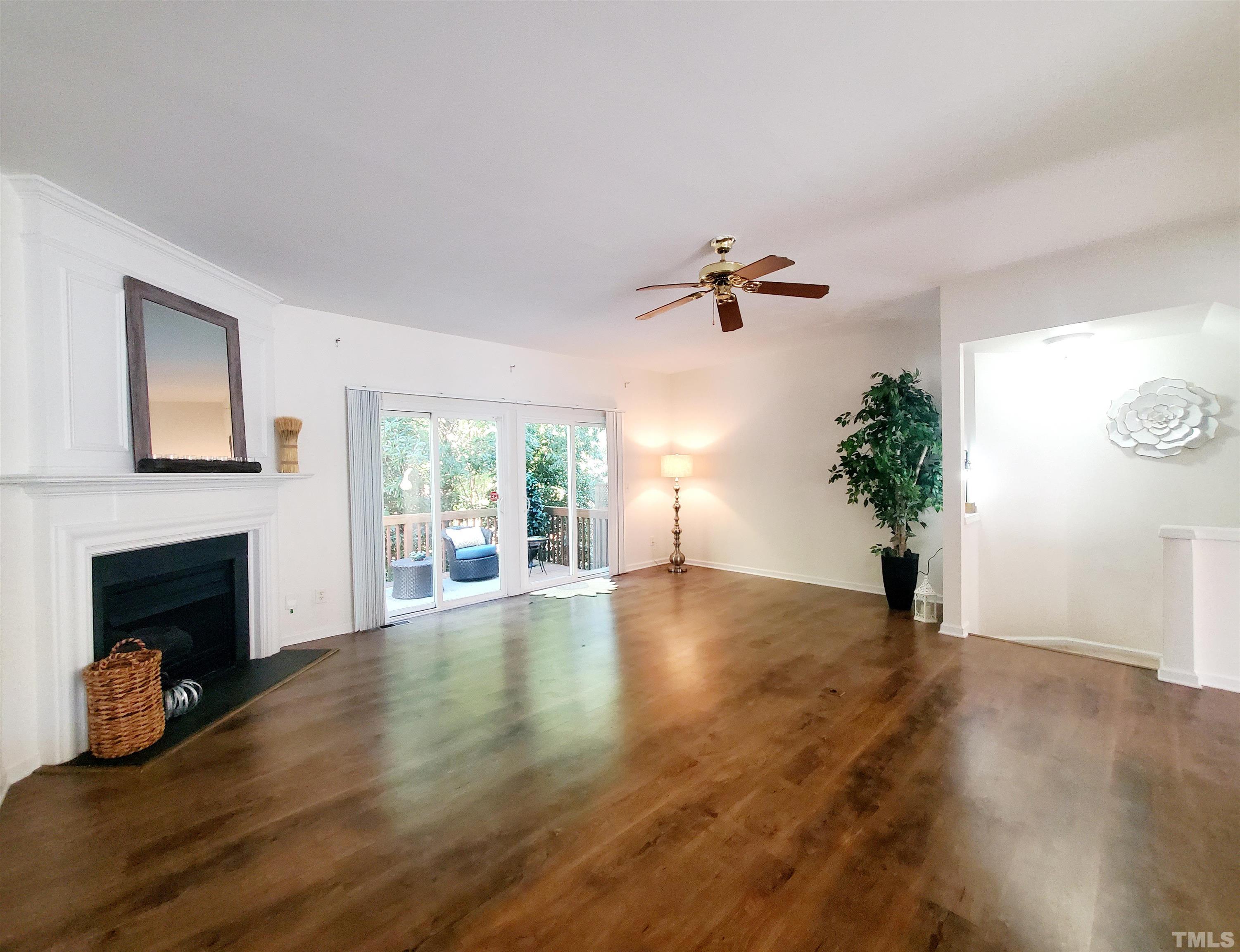 7236 Galon Glen Road Raleigh, NC 27613 - Photo 8 of 24 a view of an empty room with a window and fireplace