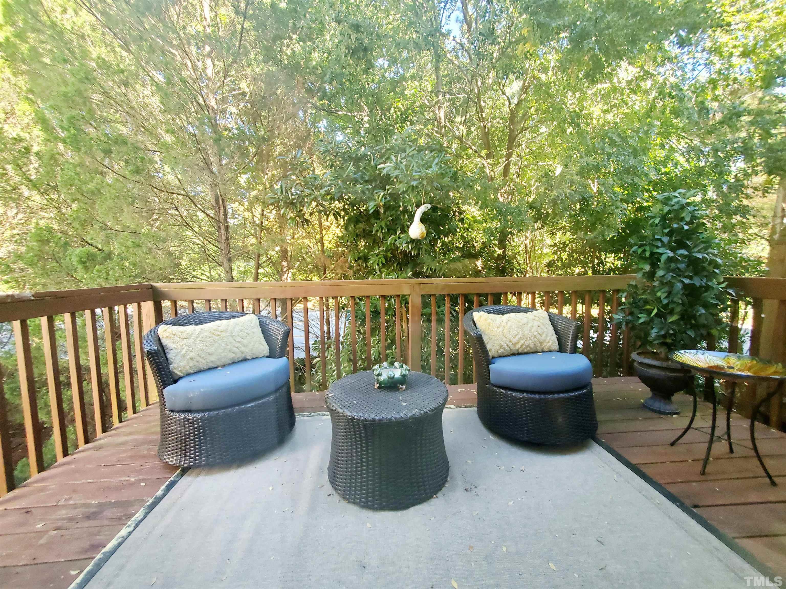 7236 Galon Glen Road Raleigh, NC 27613 - Photo 10 of 24 a view of a patio with couches and a potted plant