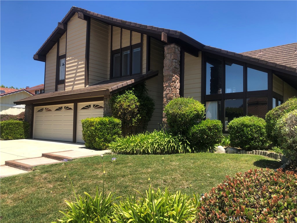 3418 Falcon Ridge Road Diamond Bar, CA 91765 - Photo 1 of 1 a front view of a house with garden