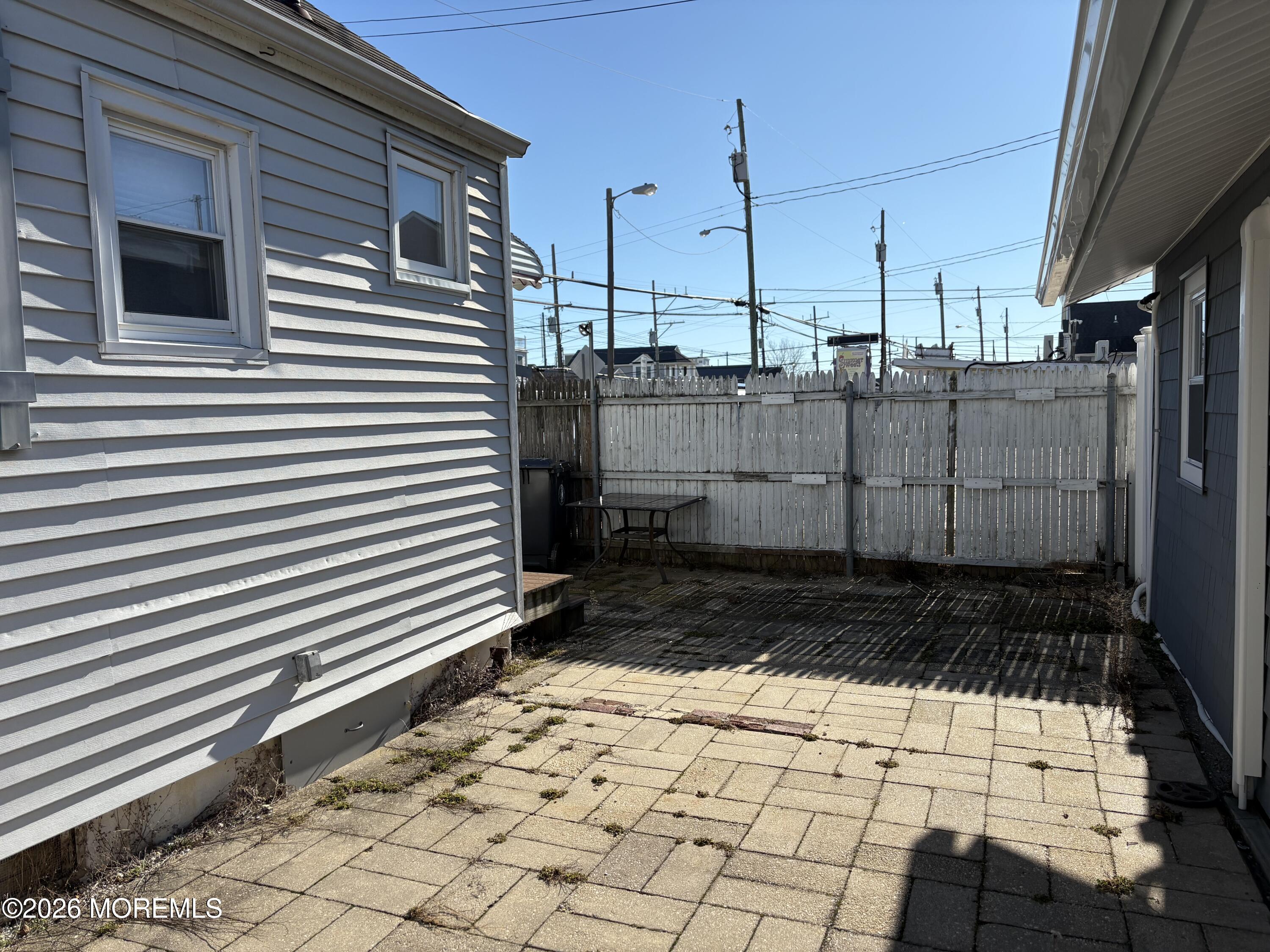 10 West Rutherford Lane Lavallette, NJ 08735 - Photo 11 of 13 a view of a backyard of the house
