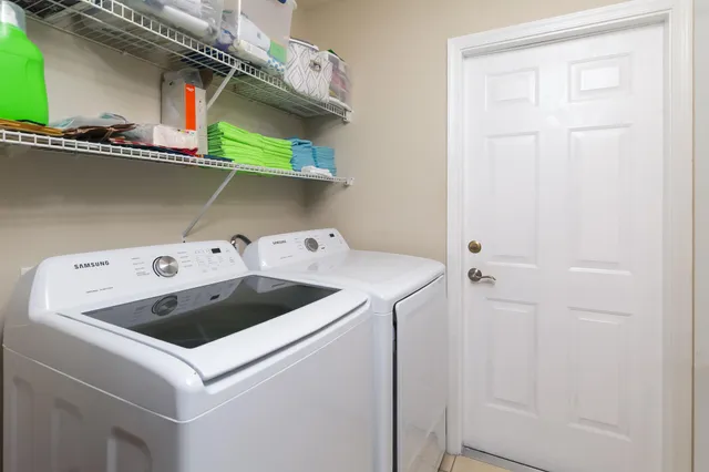 a utility room with dryer and washer