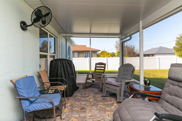 a work room with furniture and a window