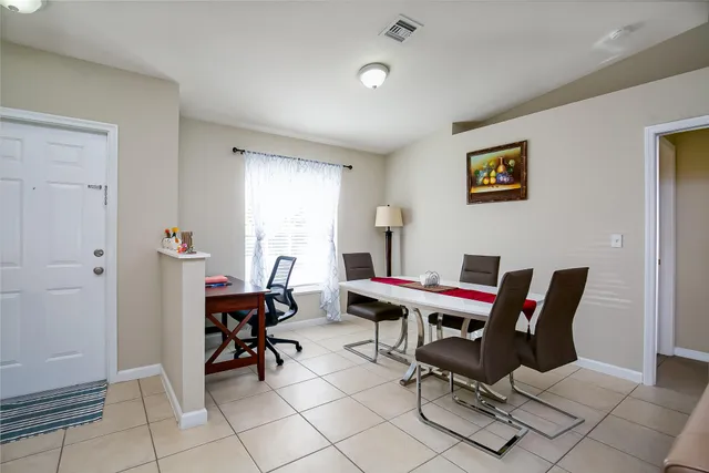 a work room with furniture and rug