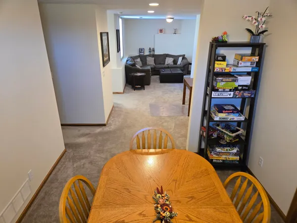 a bedroom with furniture and a book shelf