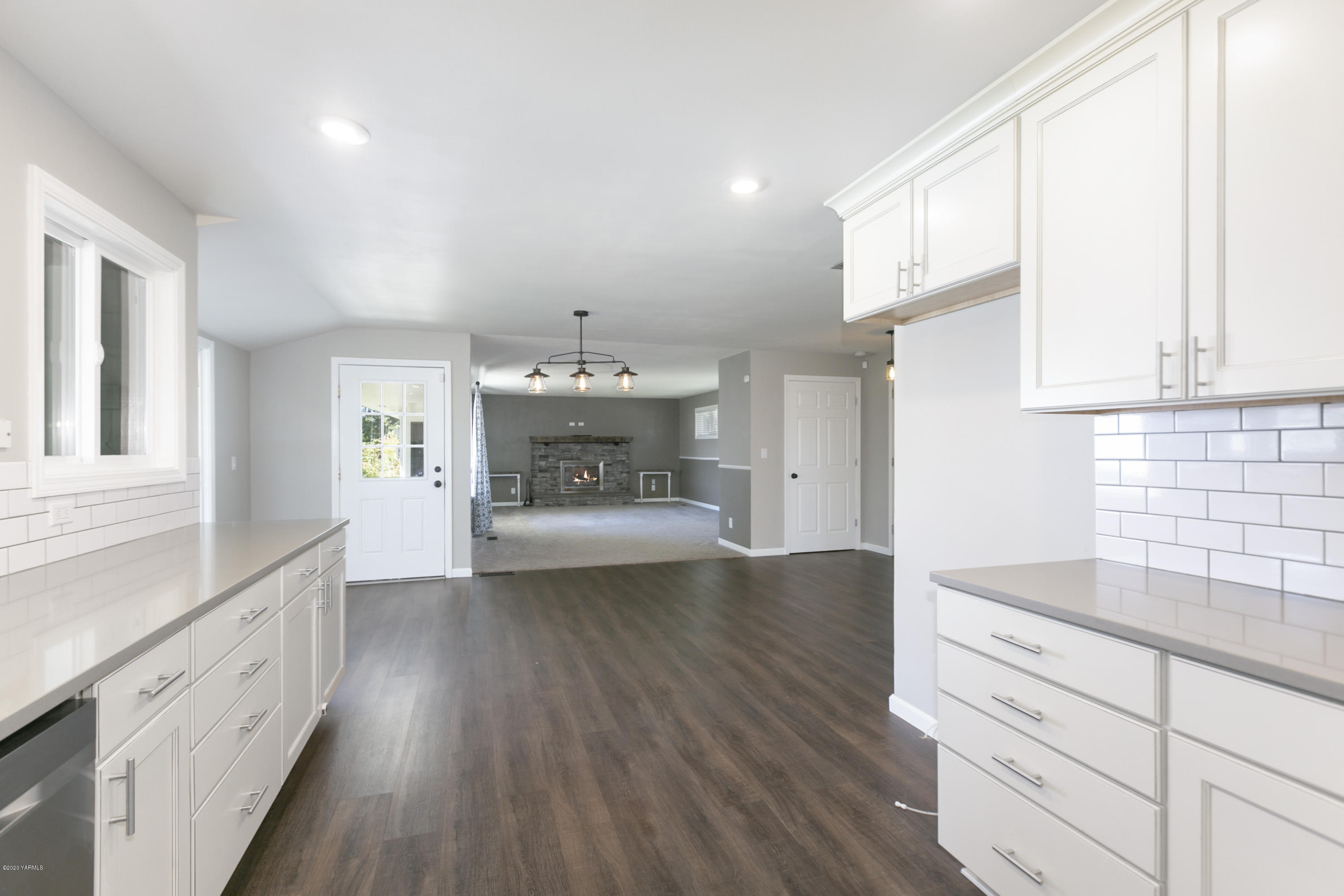 12306 Summitview Ext Road Yakima, WA 98908 - Photo 11 of 30 a kitchen with cabinets and wooden floor