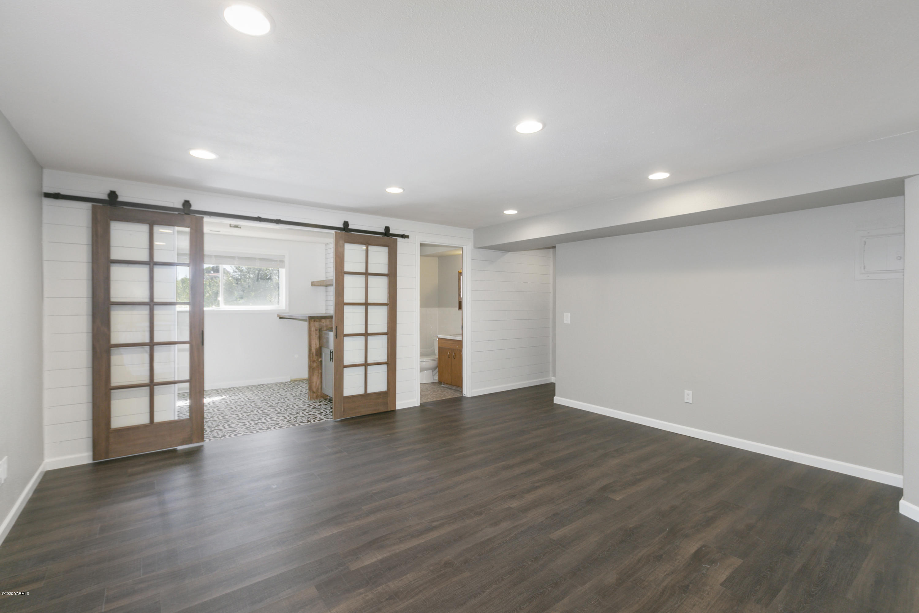 12306 Summitview Ext Road Yakima, WA 98908 - Photo 19 of 30 a view of an empty room with a window and wooden floor