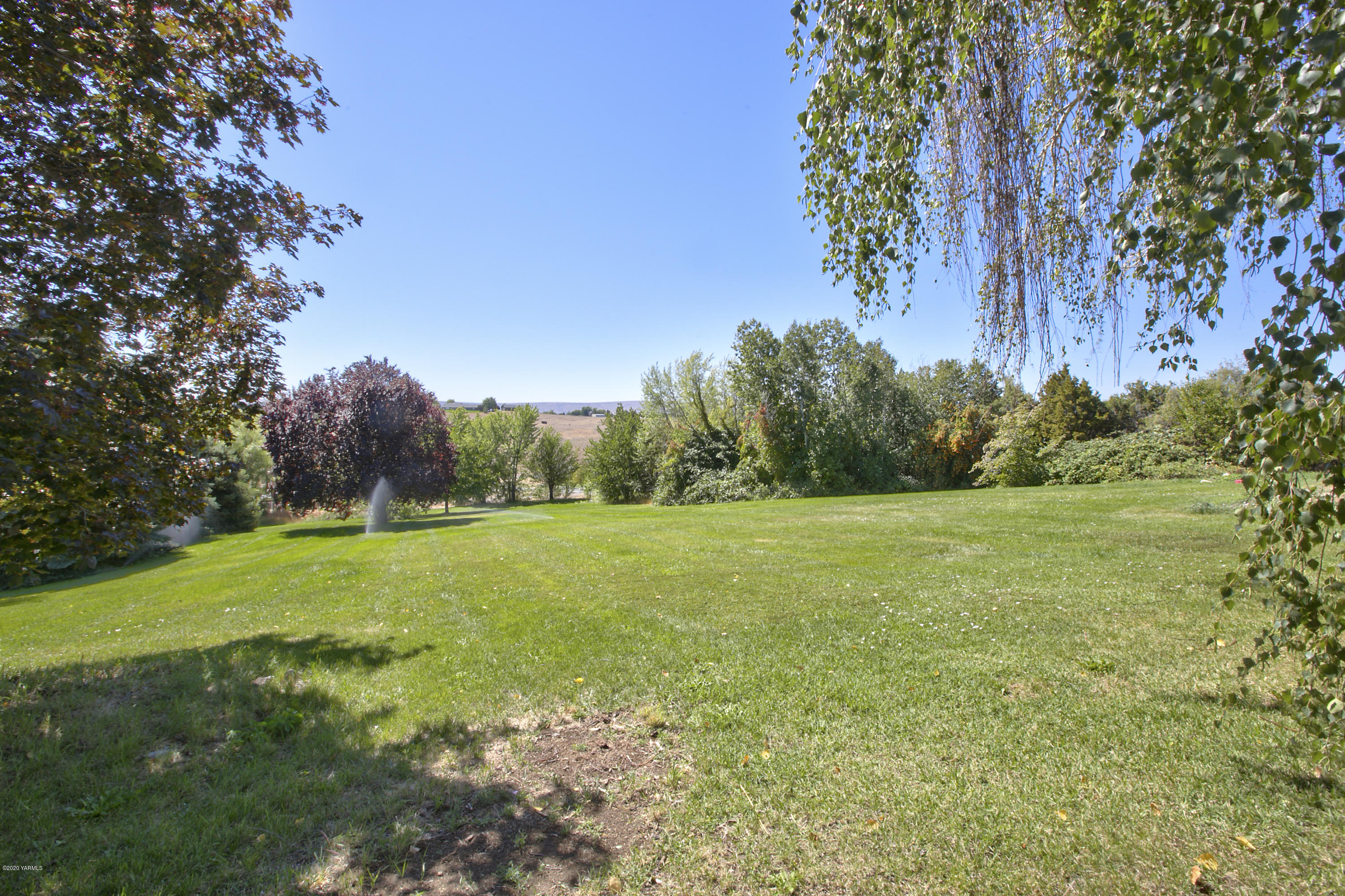 12306 Summitview Ext Road Yakima, WA 98908 - Photo 25 of 30 a view of a field with a tree