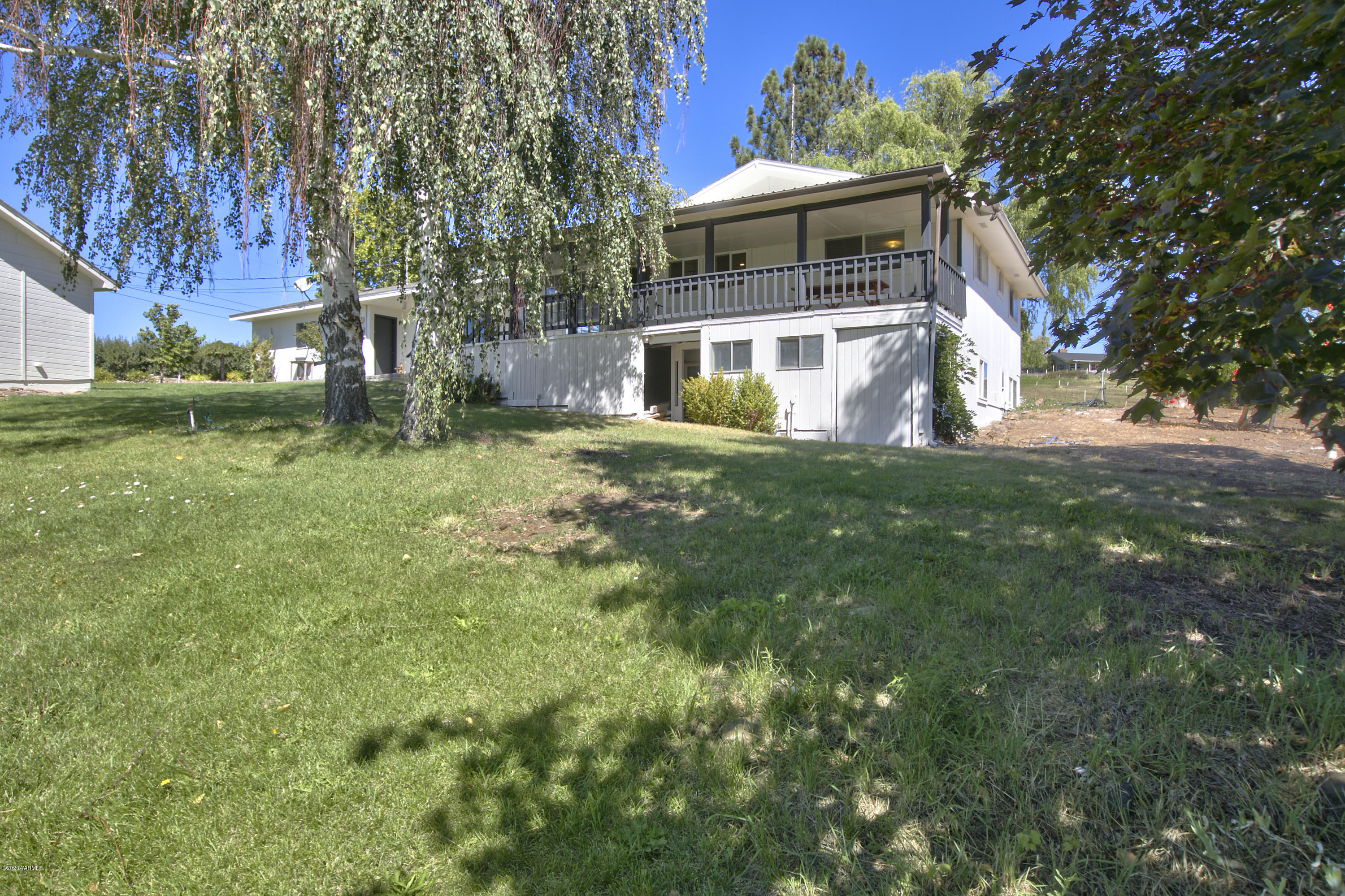 12306 Summitview Ext Road Yakima, WA 98908 - Photo 26 of 30 a front view of a house with a garden