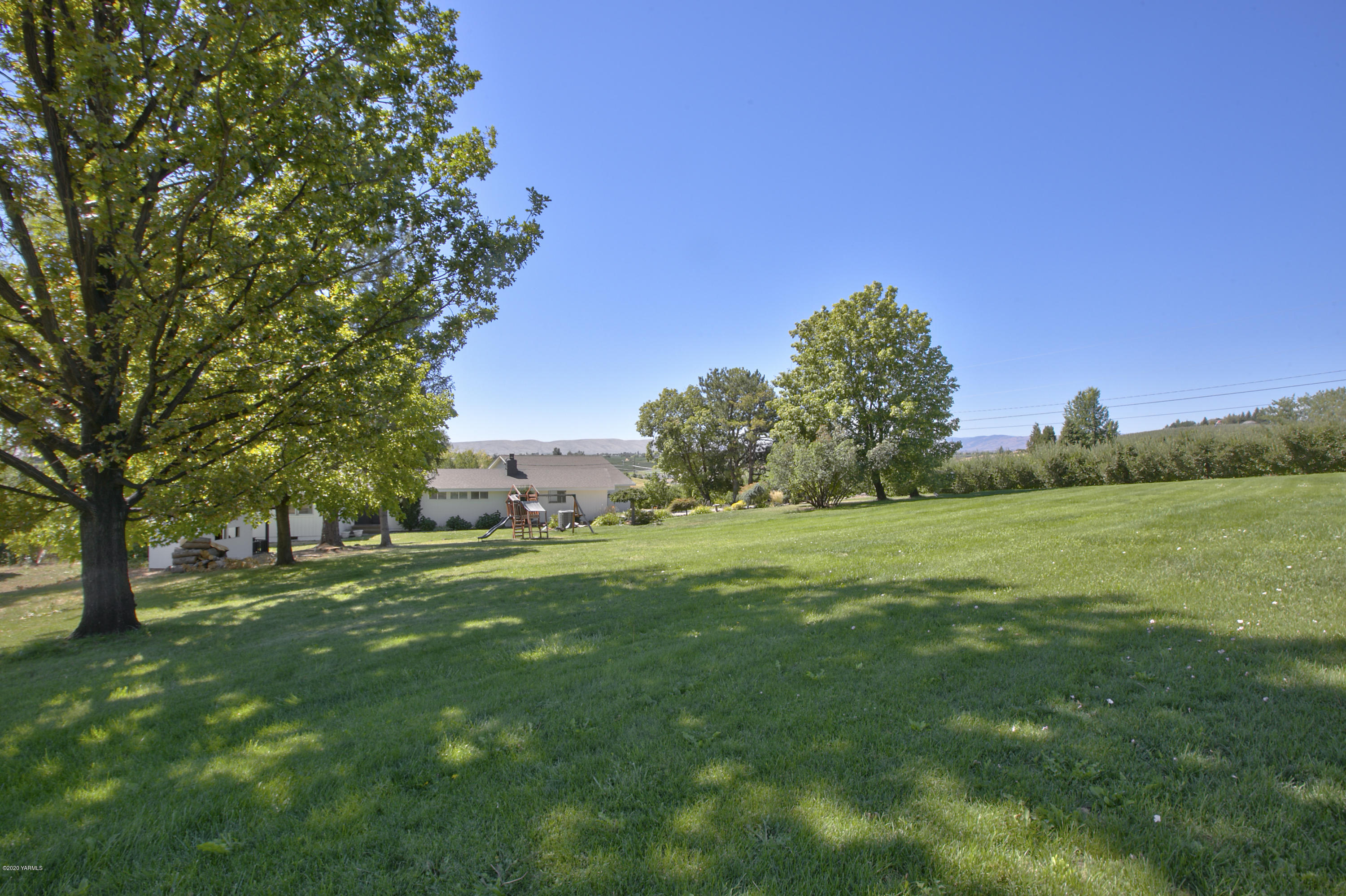 12306 Summitview Ext Road Yakima, WA 98908 - Photo 28 of 30 a view of a grassy field with trees
