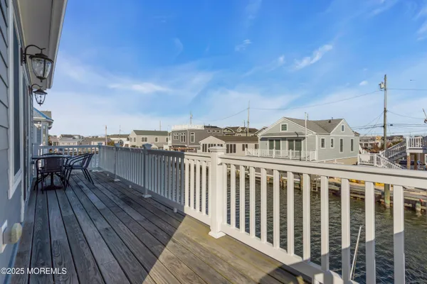 a view of a balcony with wooden floor