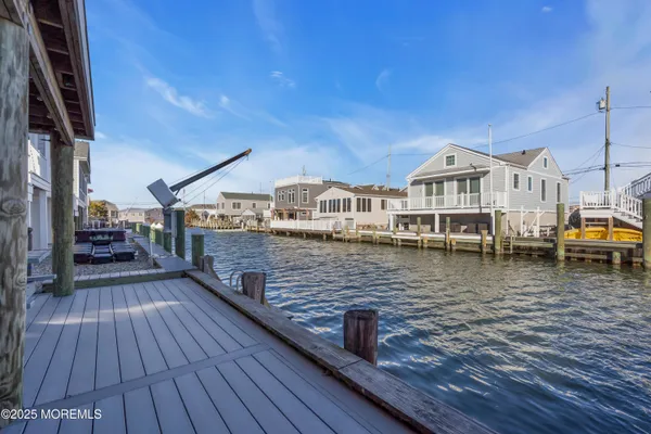 a view of a house with wooden deck