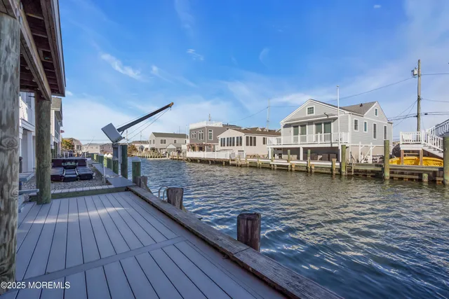 a view of a house with wooden deck