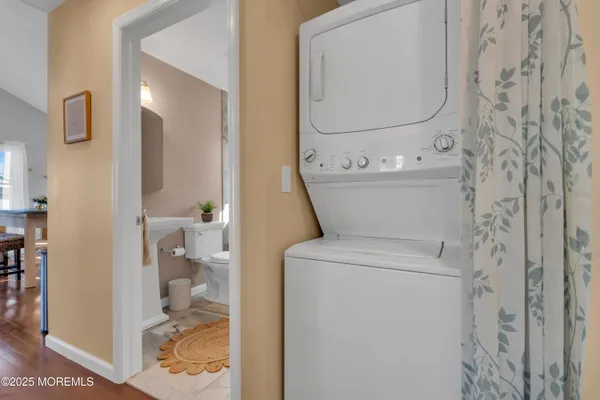 a bathroom with a toilet and a glass shower door