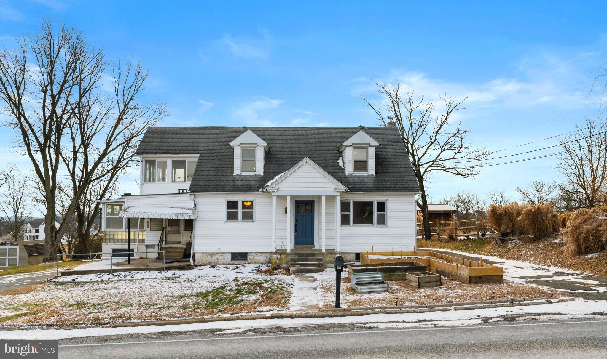 308 Hoffmansville Road Gilbertsville, PA 19525 - Photo 3 of 35 a front view of a house with garden