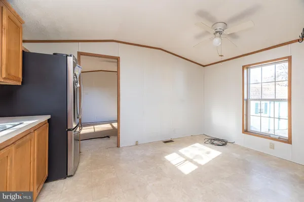 a kitchen with granite countertop a sink stainless steel appliances and cabinets