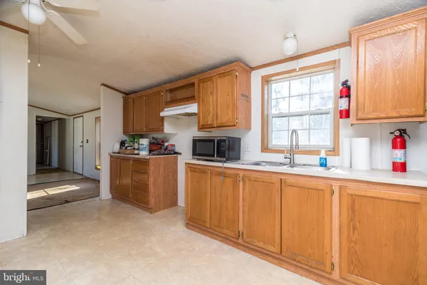 a kitchen with stainless steel appliances a refrigerator and a stove top oven