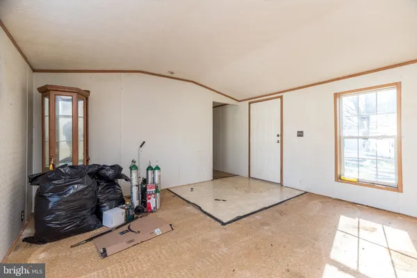 a kitchen with refrigerator and window