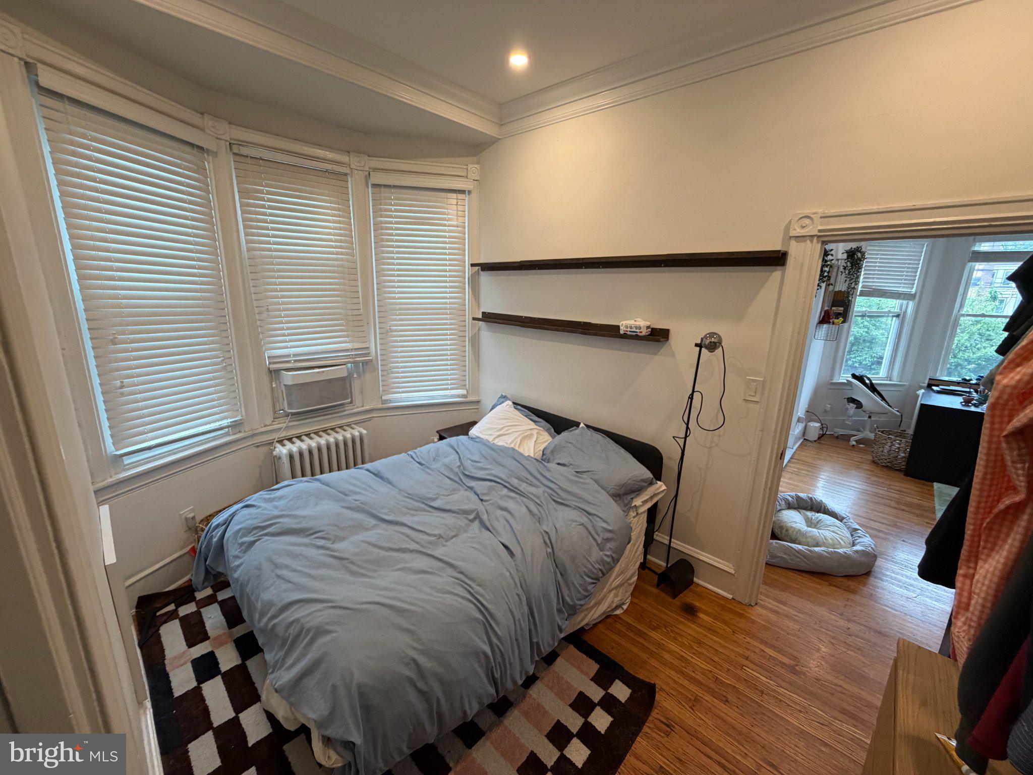 815 South 49th Street Philadelphia, PA 19143 - Photo 24 of 72 a bedroom with a bed and wooden floor