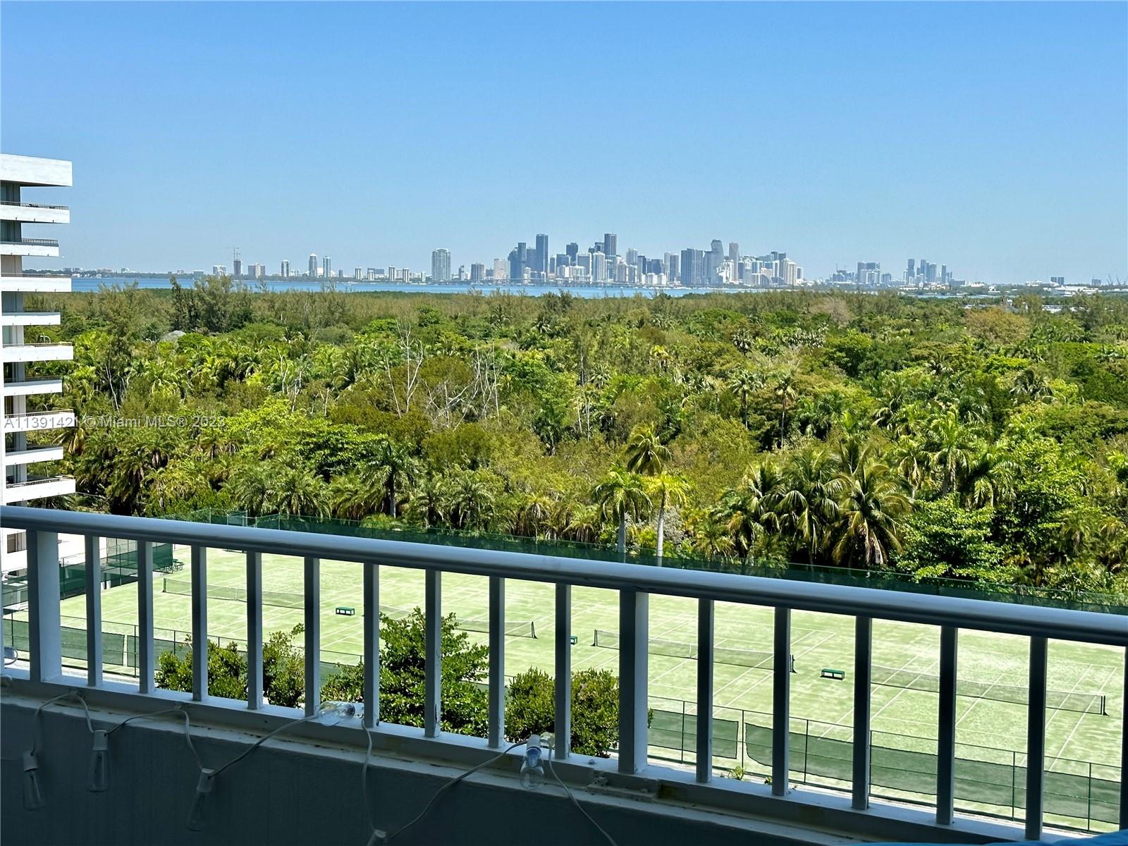 a view of balcony and yard