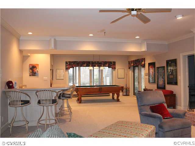 3811 Old Gun Road West Midlothian, VA 23113 - Photo 12 of 12 a living room with furniture and a flat screen tv