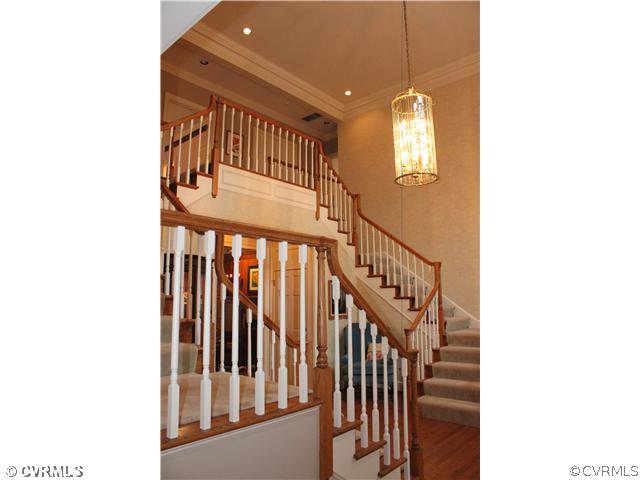 3811 Old Gun Road West Midlothian, VA 23113 - Photo 4 of 12 a view of staircase with lots of frames on wall and a window