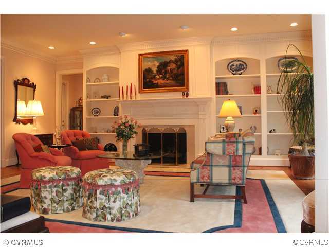 3811 Old Gun Road West Midlothian, VA 23113 - Photo 5 of 12 a living room with furniture a rug and a fireplace