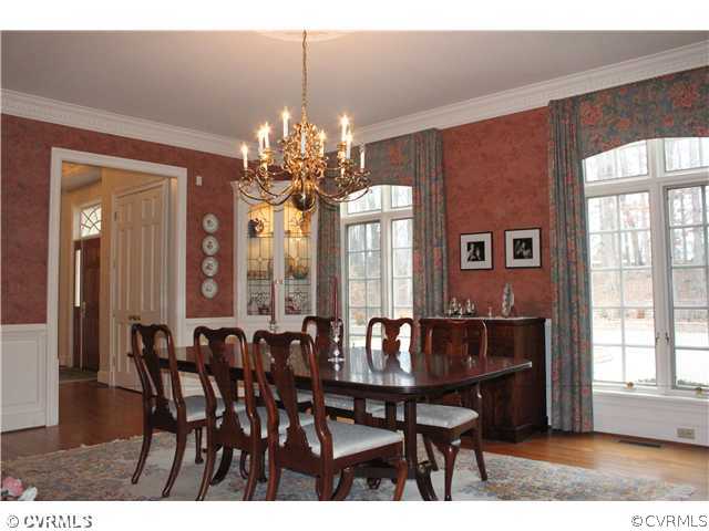 3811 Old Gun Road West Midlothian, VA 23113 - Photo 6 of 12 a view of a dining room with furniture wooden floor and chandelier