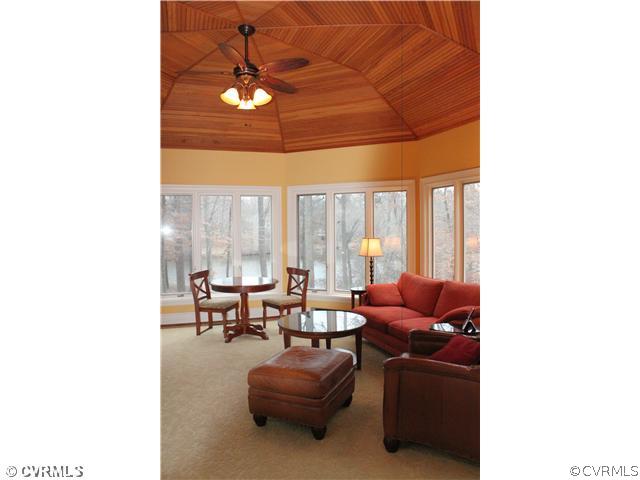 3811 Old Gun Road West Midlothian, VA 23113 - Photo 8 of 12 a living room with furniture and a large window