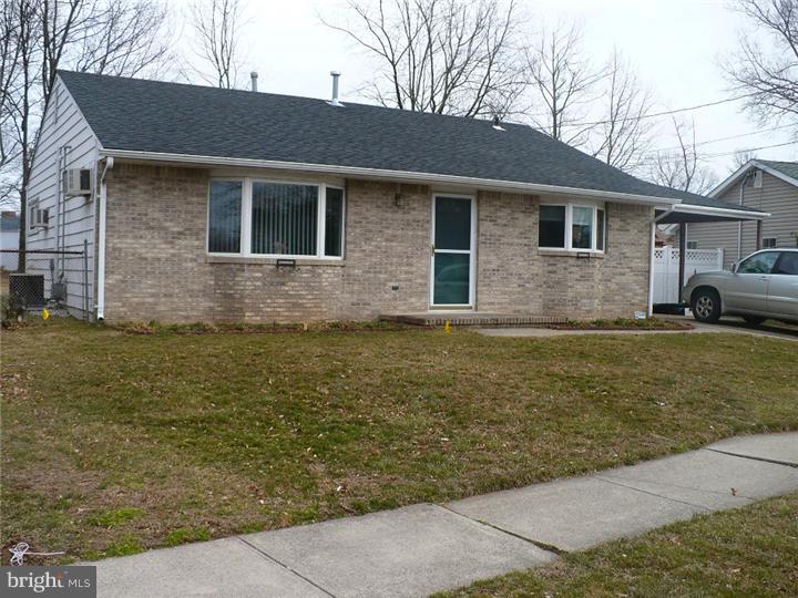 28 Comstock Road Edison, NJ 08817 - Photo 1 of 18 a front view of a house with garden