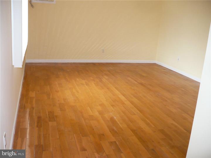 28 Comstock Road Edison, NJ 08817 - Photo 14 of 18 a view of empty room with wooden floor