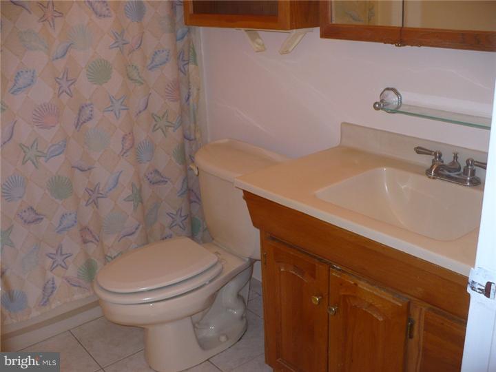 28 Comstock Road Edison, NJ 08817 - Photo 7 of 18 a bathroom with a sink and a toilet