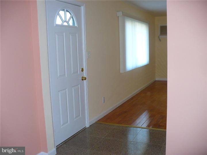 28 Comstock Road Edison, NJ 08817 - Photo 8 of 18 a view of a hallway with front door