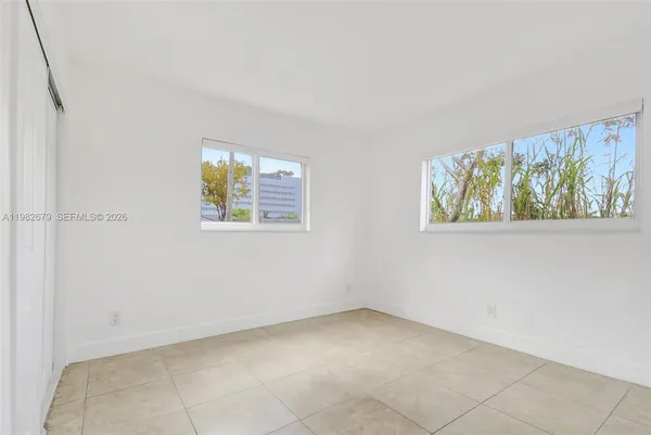 an empty room with windows