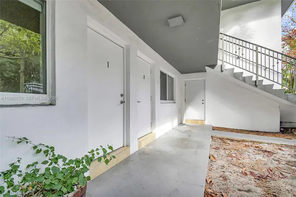 a view of a patio with a yard